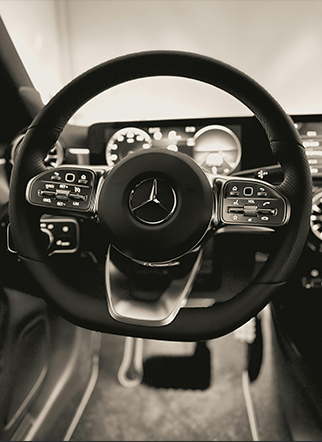 Luxury sedan door opened by Chauffeurize chauffeur